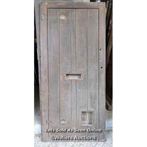 329 - A Victorian oak cottage door for restoration. Previous owner has added baton to deal with plank shri... 