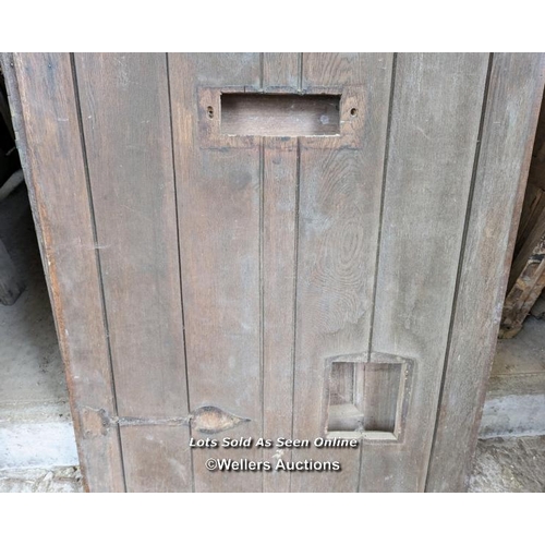 329 - A Victorian oak cottage door for restoration. Previous owner has added baton to deal with plank shri... 