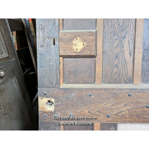 329 - A Victorian oak cottage door for restoration. Previous owner has added baton to deal with plank shri... 