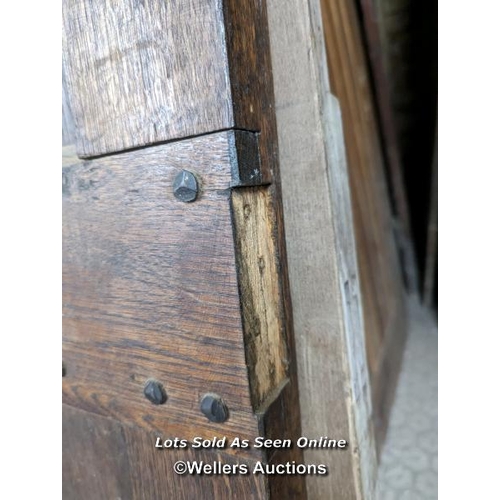 329 - A Victorian oak cottage door for restoration. Previous owner has added baton to deal with plank shri... 