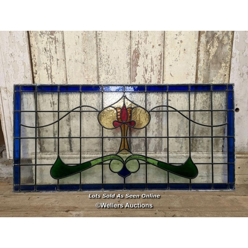 338 - A large Art Nouveau stained glass panel. 58cm x 117cm. C1925