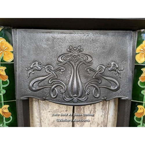 350 - A stovax cast iron fireplace insert with reproduction art nouveau tiles. Some small chips to tiles.