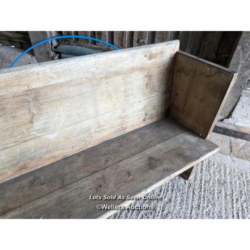 199 - A pair of solid oak pews. Grey colour and dirty due to being stored briefly outside. Height 84cm, le... 