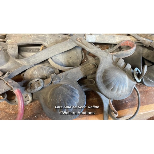 1023 - LARGE QUANTITY OF HORSE TACK, INCL. SADDLES, BLINKERS AND STIRRUPS