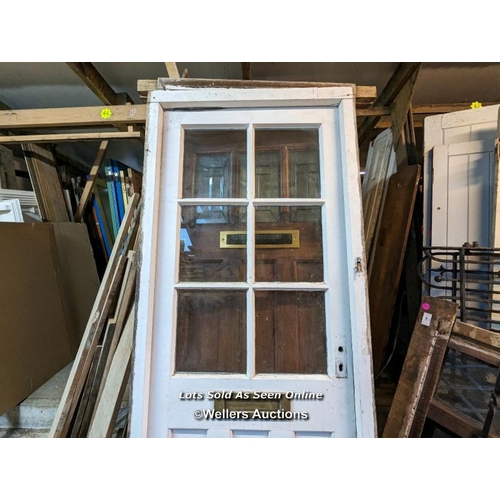 311 - Modern front door and pine frame, no lock or handle. Frame 85cmw x 208cm h x 8cm d