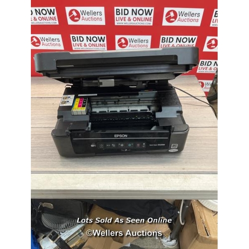 7633 - EPSON SX235W PRINTER / POWERS UP / SIGNS OF USE / H68