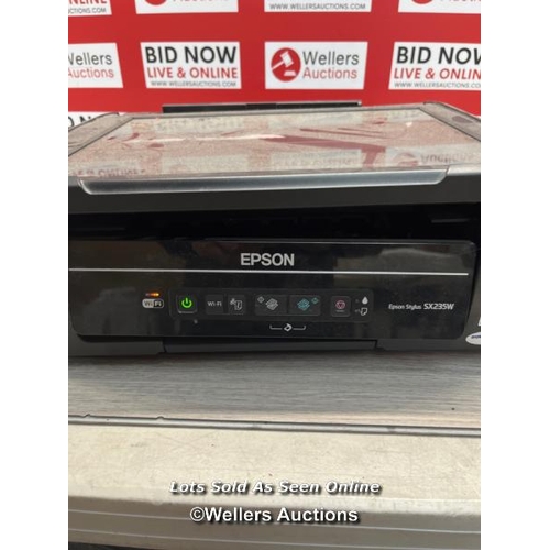 7633 - EPSON SX235W PRINTER / POWERS UP / SIGNS OF USE / H68