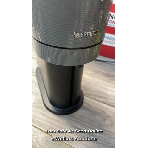 7642 - NESPRESSO VERTUO COFFEE MACHINE / MISSING WATER TANK LID AND DRIP TRAY / POWERS UP / SIGNS OF USE / ... 