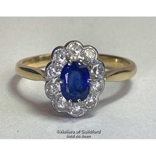 354 - Sapphire and diamond cluster ring. An oval sapphire estimated weight 0.55ct surrounded by ten single... 