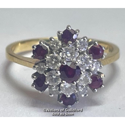 356 - Ruby and diamond double cluster ring in 18ct gold. Total diamond weight estimated as 0.50g, colour H... 