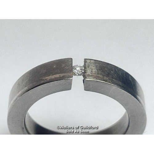 394 - Diamond and Titanium ring by Feniom. Estimated diamond weight 0.04ct, ring size I 1/2