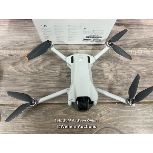 8109 - DJI MINI 3 WITH DJI REMOTE CONTROL / POWERS UP, SIGNS OF USE, HAS TWO CRACKED ARMS(SEE IMAGES), FLIE... 