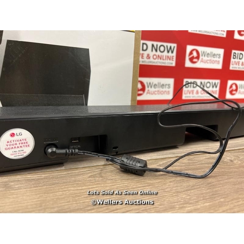 8122 - LG SN5, 2.1 CH, 400W, SOUNDBAR AND WIRELESS SUBWOOFER WITH BLUETOOTH / POWERS UP, SIGNS OF USE / NOT... 