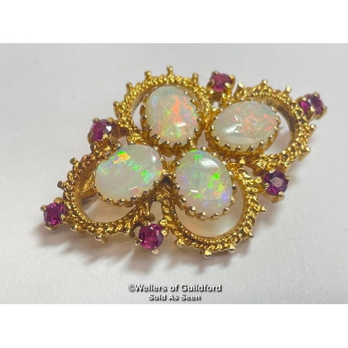 350 - Opal and ruby quatrefoil brooch in 9ct gold. Opals measure approx 9mm x 7mm. Hallmarks for Sheffield... 