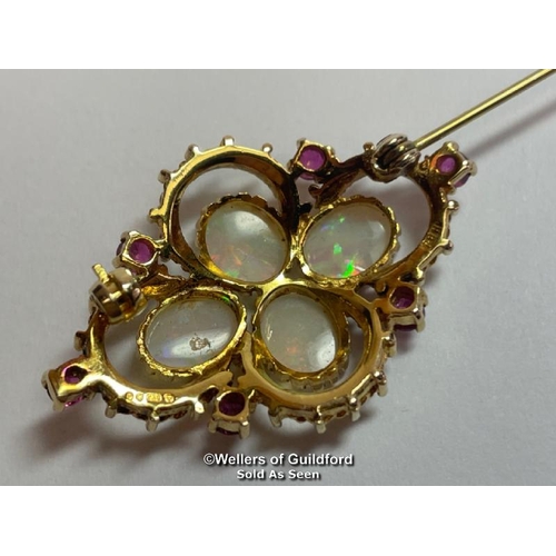 350 - Opal and ruby quatrefoil brooch in 9ct gold. Opals measure approx 9mm x 7mm. Hallmarks for Sheffield... 