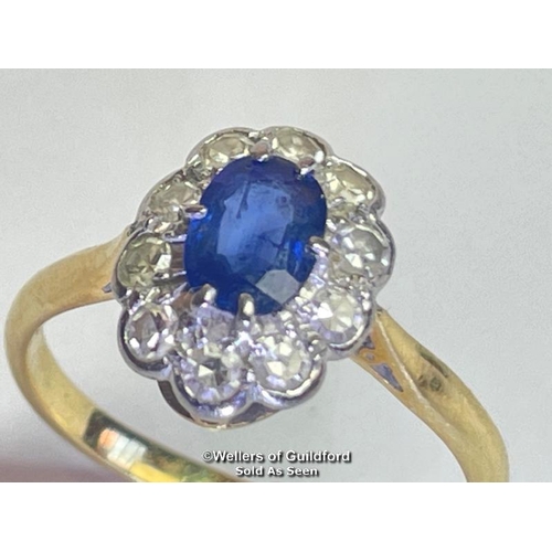 354 - Sapphire and diamond cluster ring. An oval sapphire estimated weight 0.55ct surrounded by ten single... 