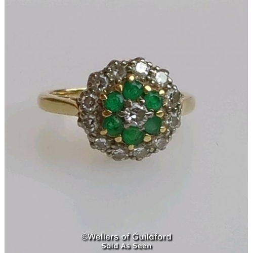 367 - Emerald and diamond round cluster ring in hallmarked 18ct gold. Central brilliant cut diamond estima... 