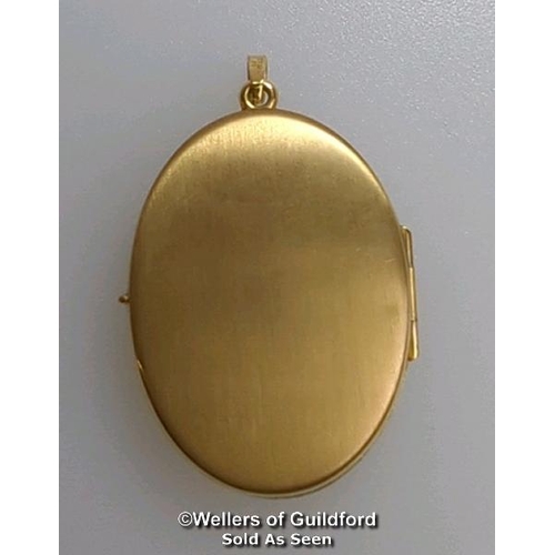 375 - Two locket pendants: one 9ct gold oval locket with engraved front, hallmarked on bail, dimensions 4c... 