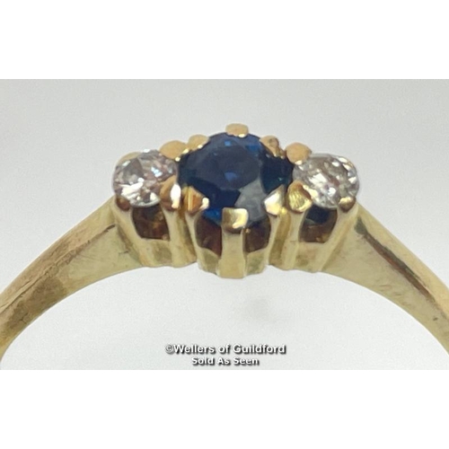 385 - Sapphire and diamond three stone ring in unmarked yellow metal. Estimated weight of sapphire 0.40ct,... 