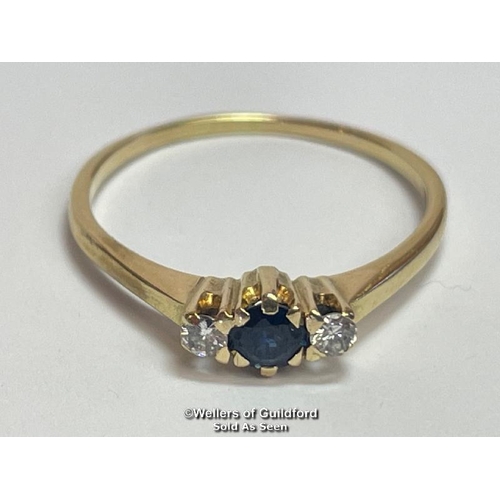 385 - Sapphire and diamond three stone ring in unmarked yellow metal. Estimated weight of sapphire 0.40ct,... 