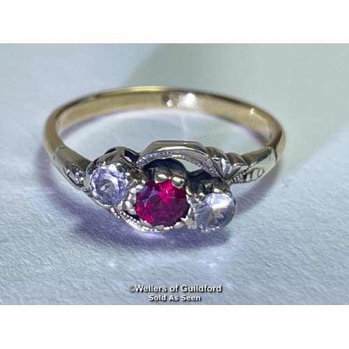 386 - Ruby and white paste three stone twist ring in yellow and white metal stamped 9ct. Estimated weight ... 