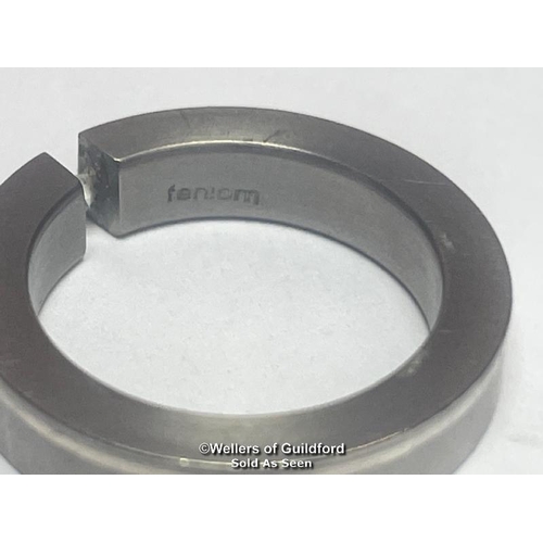 394 - Diamond and Titanium ring by Feniom. Estimated diamond weight 0.04ct, ring size I 1/2