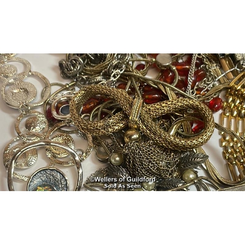 397 - Assorted costume jewellery including brooches, necklaces, bangles and cufflinks