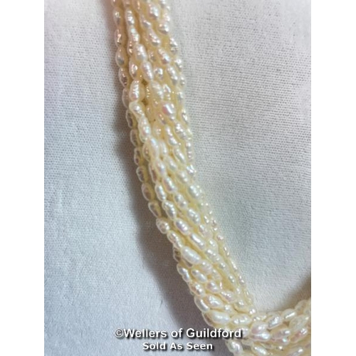 341 - A multi row necklace of eleven rows of cultured freshwater rice pearls strung to clasp set with two ... 