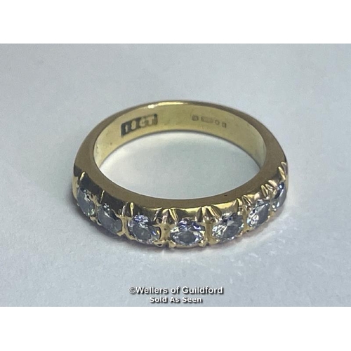 353 - Diamond eternity half band ring in 18ct gold. Seven round cut brilliant diamonds estimated total wei... 