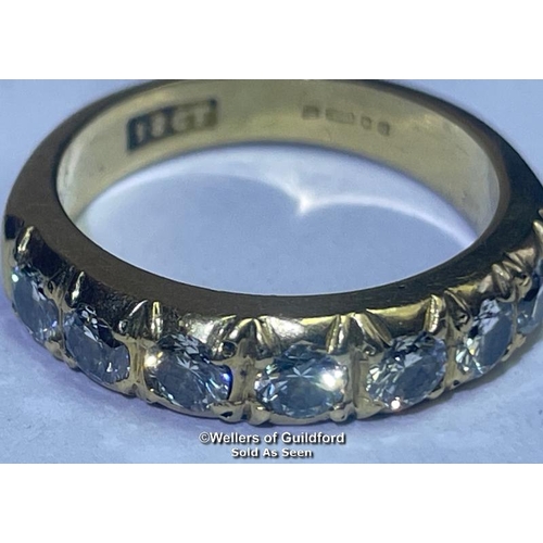 353 - Diamond eternity half band ring in 18ct gold. Seven round cut brilliant diamonds estimated total wei... 