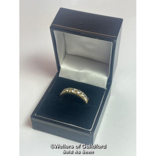 353 - Diamond eternity half band ring in 18ct gold. Seven round cut brilliant diamonds estimated total wei... 