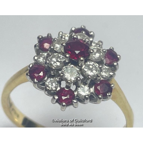 356 - Ruby and diamond double cluster ring in 18ct gold. Total diamond weight estimated as 0.50g, colour H... 