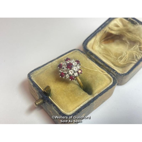 356 - Ruby and diamond double cluster ring in 18ct gold. Total diamond weight estimated as 0.50g, colour H... 