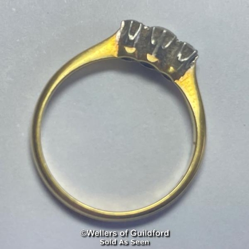 358 - Diamond three stone ring. Estimated total diamond weight 0.22ct. Shank stamped 18ct and PT. Ring siz... 