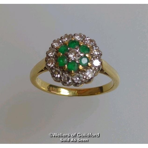 367 - Emerald and diamond round cluster ring in hallmarked 18ct gold. Central brilliant cut diamond estima... 