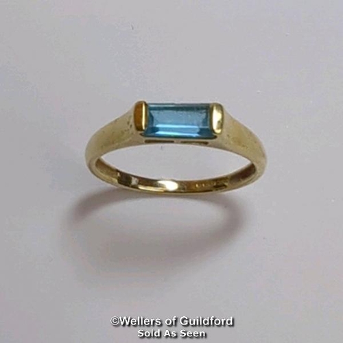 380 - Blue topaz (untested) single stone ring in hallmarked 9ct gold, by QVC. The baguette cut stone measu... 