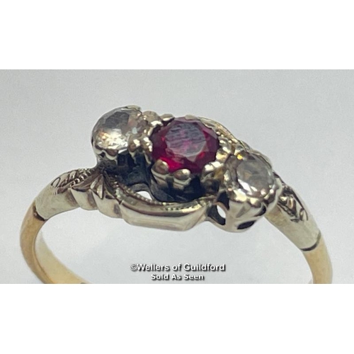 386 - Ruby and white paste three stone twist ring in yellow and white metal stamped 9ct. Estimated weight ... 