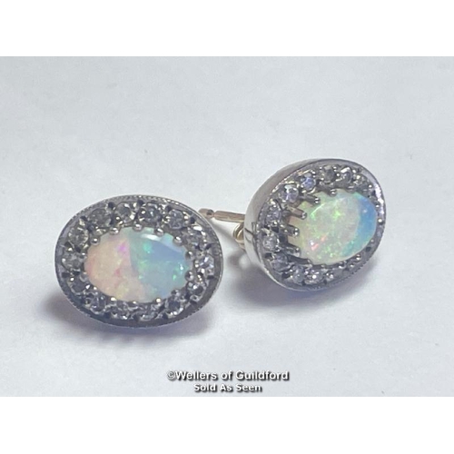 395 - A pair of oval opal and diamond cluster earings in hallmarked 9ct gold. Opals measure approx 7mm x 5... 