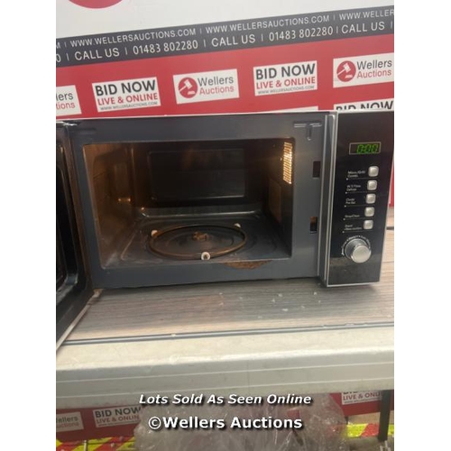 463 - DELONGHI MICROWAVE / POWERS UP / SIGNS OF USE / DAMAGED