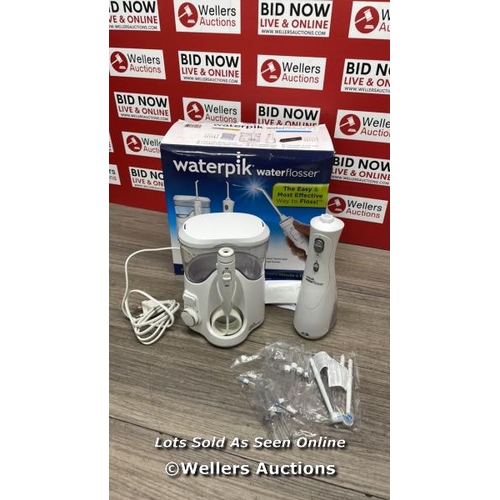 8137 - WATERPIK WATER FLOSSER / POWERS UP / SIGNS OF USE / D14