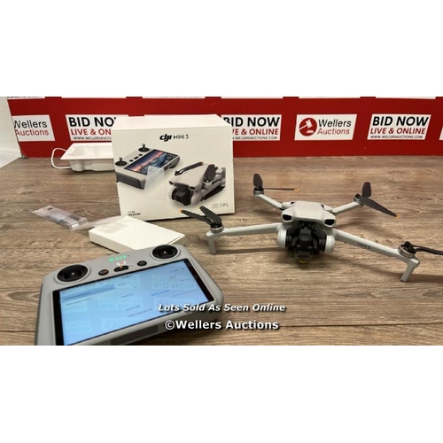 8253 - DJI MINI 3 DRONE WITH DJI REMOTE CONTROL / MINIMAL, IF ANY SIGNS OF USE / POWERS UP, FLYS AND APPEAR... 