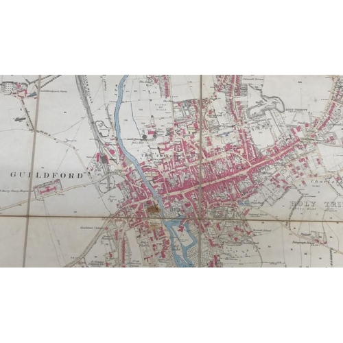 28 - A large 25 inches to 1 mile scale map of Guildford, surveyed in 1827, 202.5cm x 134.5cm opened, fold... 