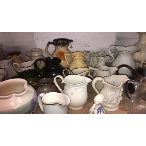 39 - A large collection of assorted jugs including Belleek / AN42