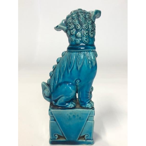 10 - Three figurines, blue glazed Chinese foo dog, 16cm high, laughing Budha, 9cm high and flute player, ... 