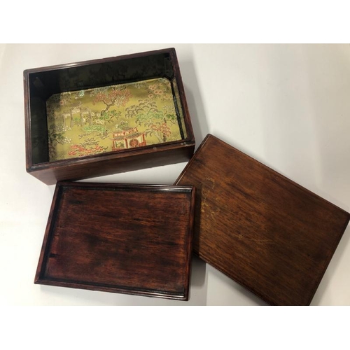 13 - Two wooden trinket boxes including one Chinese mahogany with inlaid design and silk embroidered lini... 