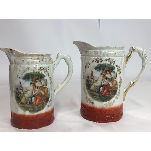 35 - Four decorative ceramic jugs and a pair of porcelain dogs / AN8