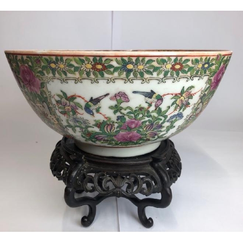 4 - A large early 20th centaury Chinese famille rose bowl decorated with a village scene, six character ... 