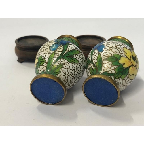 8 - A pair of vintage miniature cloisonne vases (5cm high) on wooden bases with a matching round trinket... 