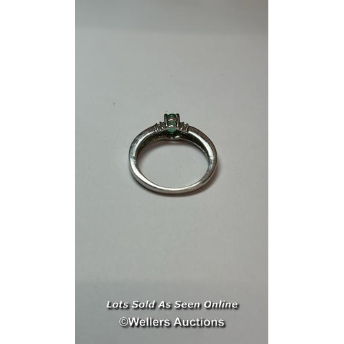 166 - Emerald and silver ring. Ring size, O. (one stone missing) / SF