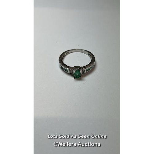 166 - Emerald and silver ring. Ring size, O. (one stone missing) / SF